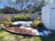 View of a landscaped backyard with a shed, pavers, fence, and mulch at 7138 Hiawassee Bent Cir, Orlando, FL 32818