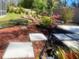 Tranquil backyard with mulch, stone pavers, and solar lights at 7138 Hiawassee Bent Cir, Orlando, FL 32818