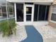 Enclosed patio exterior with stepping stones and an enclosed lanai at 7138 Hiawassee Bent Cir, Orlando, FL 32818