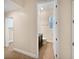 Hallway bathroom with dark vanity and tiled floors at 8348 Via Rosa, Orlando, FL 32836