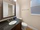 Bathroom featuring vanity with granite top, oval sink, and bronze fixtures at 8348 Via Rosa, Orlando, FL 32836