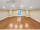 Spacious bonus room with hardwood floors, recessed lighting, and a bright window at 8348 Via Rosa, Orlando, FL 32836