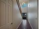 Bright foyer with high ceilings, stylish tile flooring, a staircase, and transom window over the front door at 8348 Via Rosa, Orlando, FL 32836