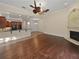 Spacious living room with hardwood flooring flowing into adjacent areas, offering a bright and airy feel at 8348 Via Rosa, Orlando, FL 32836