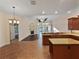 Open-concept living room features tile flooring, decorative fireplace, and a seamless transition to the kitchen at 8348 Via Rosa, Orlando, FL 32836