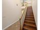 Elegant staircase with wood steps, decorative railing, and tiled landing at 8348 Via Rosa, Orlando, FL 32836