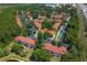 Aerial view of a colorful townhome community near a highway at 8523 Crystal Cove Loop, Kissimmee, FL 34747