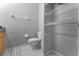 Bright bathroom with toilet and wire shelving for storage at 8523 Crystal Cove Loop, Kissimmee, FL 34747