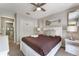 Bedroom with a plush bed, lamps, closet, and neutral colors at 8523 Crystal Cove Loop, Kissimmee, FL 34747