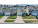 Exterior view of two homes with well-manicured lawns and driveways, featuring attached garages at 863 August Sky Dr, Deltona, FL 32738