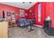 Unique red bedroom with a desk, dark-colored furniture, red curtains, and a large window at 8982 Fort Jefferson Blvd, Orlando, FL 32822