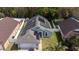 Charming home featuring solar panels, a well-manicured lawn, and a welcoming front entrance at 8982 Fort Jefferson Blvd, Orlando, FL 32822