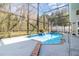 Screened in pool with fountain feature, stainless steel pool railing, and ample deck space at 8982 Fort Jefferson Blvd, Orlando, FL 32822