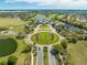 Aerial view of a community with a golf course, lakes, and lush landscaping highlighting an active lifestyle at 9406 Mere Pkwy, Orlando, FL 32832