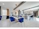 Dining area with modern decor, a marble dining table, and stylish chairs at 9406 Mere Pkwy, Orlando, FL 32832