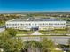 Exterior view of Eagle Creek Elementary School featuring well-maintained landscaping and ample parking at 9406 Mere Pkwy, Orlando, FL 32832