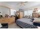 Bedroom with tile floor offers neutral tones, a ceiling fan, and ample storage at 950 Sylvia Dr, Deltona, FL 32725