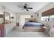 Bedroom featuring tile flooring, a ceiling fan, and plenty of space for a dresser and nightstands at 950 Sylvia Dr, Deltona, FL 32725