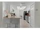 Well-lit kitchen features white cabinetry, granite counters, breakfast bar, and modern stainless appliances at 950 Sylvia Dr, Deltona, FL 32725