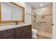 Well-appointed bathroom featuring a granite-topped vanity, a walk-in shower with custom tile, and modern fixtures at 1026 Woodall Dr, Altamonte Springs, FL 32714