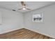 Bedroom featuring wood-look flooring, white walls, a modern ceiling fan, and natural light from a single window at 1026 Woodall Dr, Altamonte Springs, FL 32714