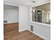 Dining area with wood-look flooring, modern light fixture, and window to outdoor space at 1026 Woodall Dr, Altamonte Springs, FL 32714