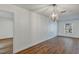 Bright dining area features wood floors, white walls, updated lighting, and neutral colors at 1026 Woodall Dr, Altamonte Springs, FL 32714