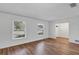 Clean living room featuring laminate flooring and a neutral color palette at 1026 Woodall Dr, Altamonte Springs, FL 32714