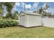 View of outdoor shed with roll up door in the backyard at 1026 Woodall Dr, Altamonte Springs, FL 32714