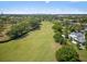 Breathtaking aerial view of a lush golf course with Orlando skyline in the background at 1037 N Virginia Ave, Winter Park, FL 32789