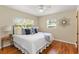 Bedroom featuring hardwood floors, a large bed, and lots of natural light at 1037 N Virginia Ave, Winter Park, FL 32789