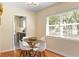 Bright dining area with modern table and chairs, hardwood floors, and ample natural light at 1037 N Virginia Ave, Winter Park, FL 32789