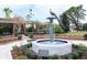 Beautiful fountain with peacock statue surrounded by landscaped gardens at 1037 N Virginia Ave, Winter Park, FL 32789