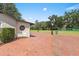 Exterior shot of golf course office with brick patio overlooking the putting green at 1037 N Virginia Ave, Winter Park, FL 32789