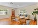 Inviting living room showcasing hardwood floors, natural light, and stylish furniture at 1037 N Virginia Ave, Winter Park, FL 32789