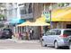 Busy street view with outdoor dining and shopfronts on a sunny day at 1037 N Virginia Ave, Winter Park, FL 32789