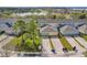 Aerial view of townhomes featuring driveways and green lawns at 14143 Ancilla Blvd, Windermere, FL 34786