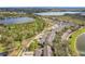 Aerial view of neighborhood featuring community lakes and manicured landscaping at 14143 Ancilla Blvd, Windermere, FL 34786