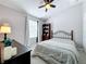 Guest bedroom with neutral walls, plush carpeting and a ceiling fan at 14143 Ancilla Blvd, Windermere, FL 34786