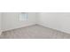 The carpeted bedroom has a window with blinds at 1417 Arbor Hill Dr, Deltona, FL 32725