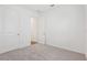 Bright bedroom featuring neutral carpet, white walls, and a closet at 1417 Arbor Hill Dr, Deltona, FL 32725