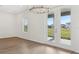 Living room with hardwood floors, recessed lighting, chandelier, and natural light from windows at 1417 Arbor Hill Dr, Deltona, FL 32725