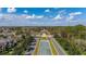 Scenic aerial view of the community center framed by manicured landscaping and a tranquil water feature in the neighborhood at 14203 Avenue Of The Grvs, Winter Garden, FL 34787