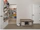 Organized pantry with wire shelving and a shoe rack on the door for optimal storage at 14203 Avenue Of The Grvs, Winter Garden, FL 34787