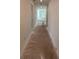 Unfinished long hallway, offering a view of the house's interior and natural light at 1453 Arbor Hill Dr, Deltona, FL 32725