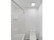 A clean and bright bathroom includes a shower and a toilet at 1536 Softshell St, St Cloud, FL 34771