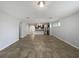 Bright and airy living room features neutral tile flooring, an open layout, and a seamless transition to the kitchen at 1536 Softshell St, St Cloud, FL 34771