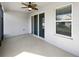 Covered patio with a ceiling fan, providing a comfortable outdoor living space with access to the backyard at 1536 Softshell St, St Cloud, FL 34771