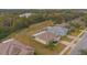 Aerial view of a well-maintained home with a screened lanai and green surroundings at 1660 Mountclair Ct, Mount Dora, FL 32757