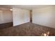 Spacious living room area with carpet flooring and bright white walls at 1801 Riley Ave, Orlando, FL 32805